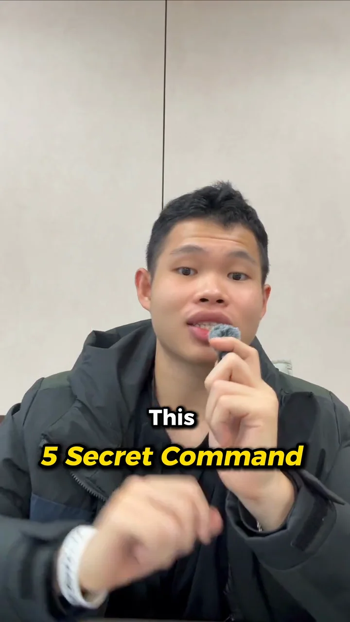 A presenter holding a microphone in a captioned AI prompt tips video
